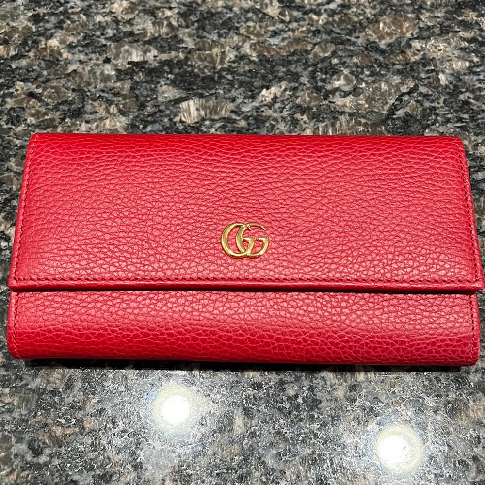 Gucci ❤️AUTHENTIC large red leather wallet like new. Gently used.